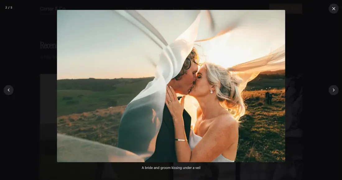 A wedding photo open full screen over a dark background, with a counter reading 2 / 5, previous and next arrows, a close button and the caption below the picture