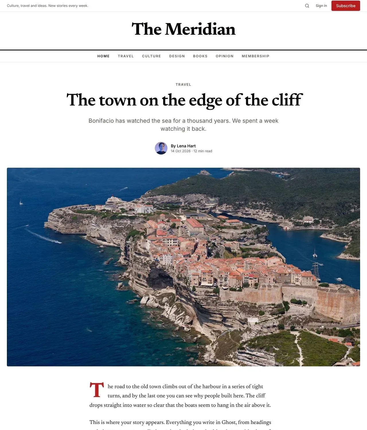 A story in the Magazine theme: a Travel label, the headline The town on the edge of the cliff, a standfirst, the author's byline and a wide photo of the town above the sea, then the text with a red drop cap